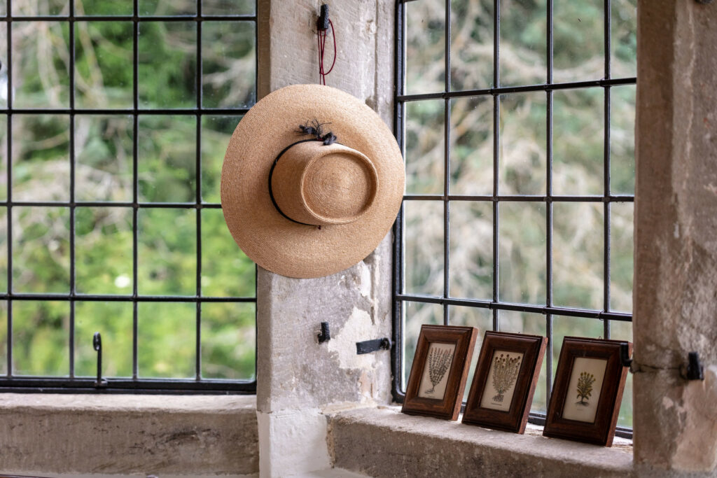 A hat and a picture on a window sill, adding charm to the room's decor.