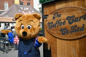 Benny Bear outside Coffee Cart in High Town