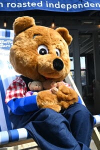 Benny Bear sat in a beach chair outside Coffee Cart